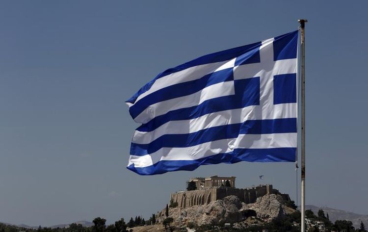 544996-a-greek-flag-flutters-in-front-of-the-acropolis-hill-in-athens.jpg